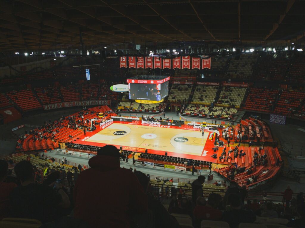 A view of a basketball court from the upper level of a stadium
